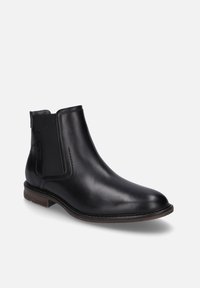 Černé kožené chelsea boty s elastickými bočními panely, zaoblenou špičkou, prošitím a nízkým hnědým blokovým podpatkem. Hladká textura po celém povrchu.