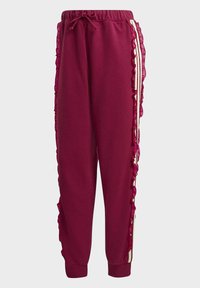 Bordové tepláky se zřasenými růžovými bočními detaily, elastickým pasem, šňůrkou na stažení a manžetovými lemy. Bílé pruhy zvýrazňují design.