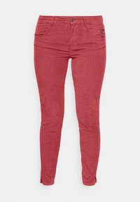 Pantaloni in velluto a coste rossi con vestibilità slim, caratterizzati da una tasca frontale, una tasca laterale con zip e uno spacco corto all'orlo.