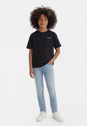Calvin Klein Jeans POLAROID UNISEX - Nyomott mintás póló - black