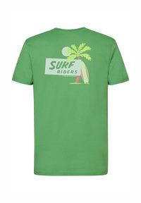Zelené bavlněné tričko s grafikou palmy a surfovacího prkna v růžové a zelené barvě, s textem "SURF RIDERS" na zadní straně.