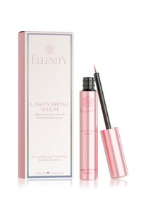 Lash 'n' Brow Serum in a sleek pink tube with black cap, housed in a matching pink and white box. Text on box describes serum benefits.