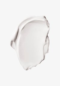 Hvid creme eller lotion med en glat, let skinnende tekstur, buede kanter og en blød, tyk konsistens. Ingen synlige mønstre eller hardware.