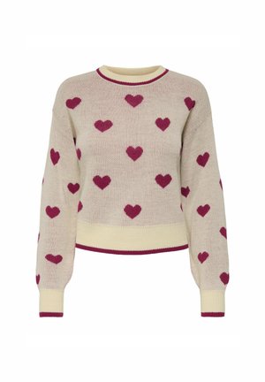 Pull en tricot beige à manches longues, décoré de motifs de cœurs roses foncés régulièrement espacés et d'une bordure rose foncé assortie aux poignets, à l'ourlet et au col.