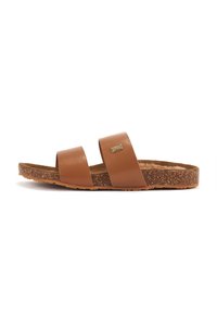 Brown leather slide sandals with two wide straps, textured footbed, and a cork-like outsole. Features a small metallic logo detail.