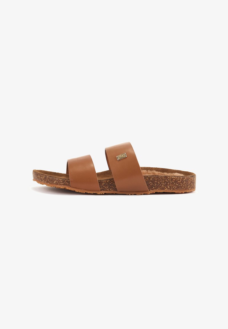 Brown leather slide sandals with two wide straps, textured footbed, and a cork-like outsole. Features a small metallic logo detail.