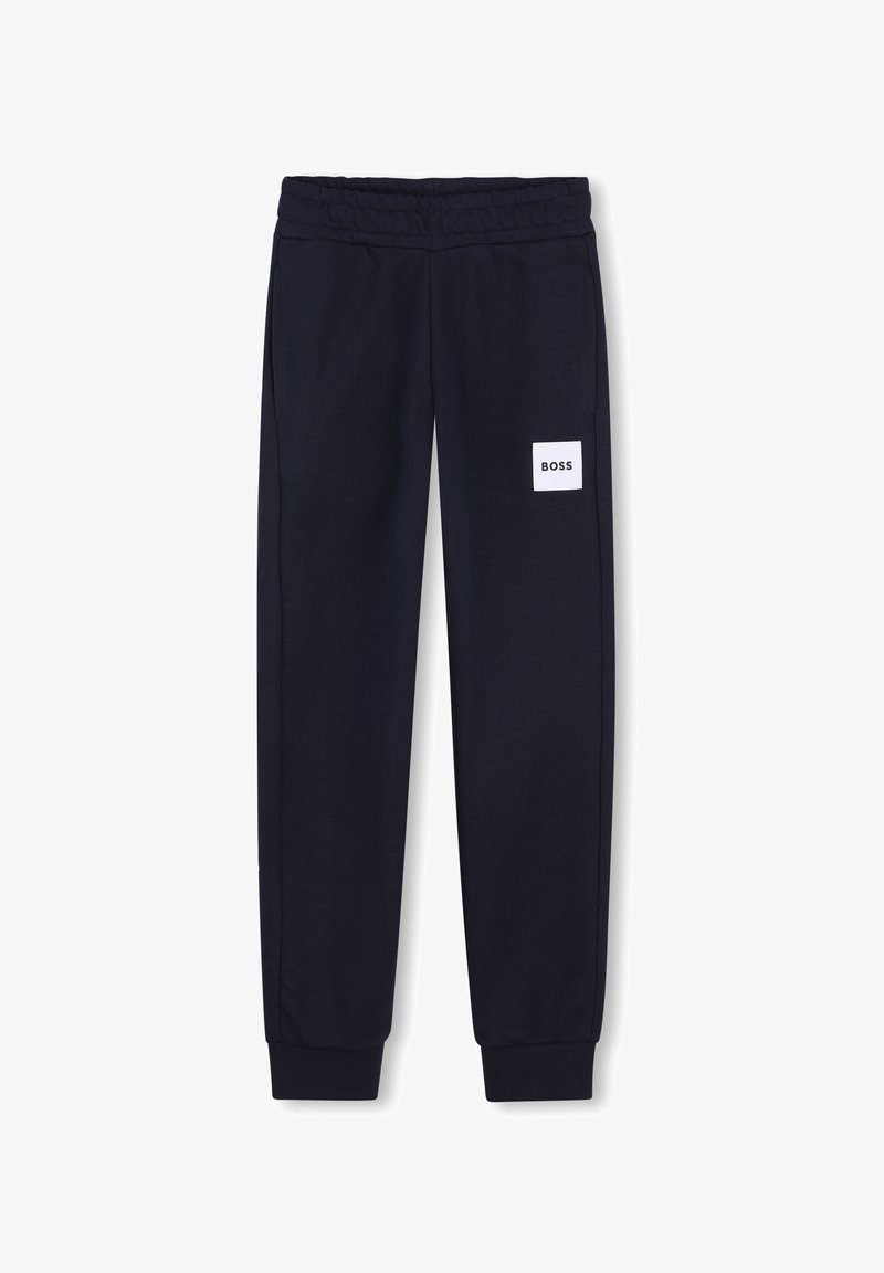 Pantalon de survêtement bleu marine avec taille et poignets élastiques, doté d'un patch logo rectangulaire blanc portant l'inscription "BOSS" sur la cuisse droite.