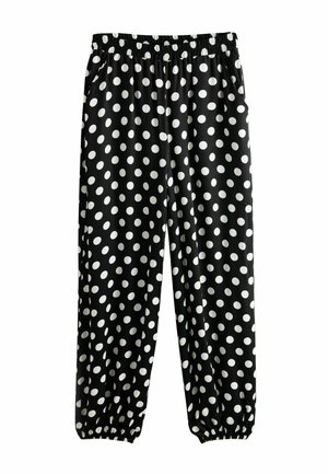 Fekete nadrág fehér pöttyökkel, rugalmas derékpánttal és boka mandzsettákkal, valamint oldalzsebekkel.