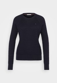 Marineblau gestrickter Pullover mit strukturiertem Muster, Rundhalsausschnitt und langen Ärmeln; verfügt über ein kleines, dreifarbige Logo auf der Brust.