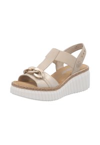 Sandales à plateforme beiges avec un design à lanières croisées, mettant en avant un accent en chaîne métallique et une semelle en EVA blanche texturée.