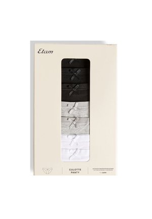 Lot de sept culottes en coton pour femmes en noir, gris et blanc, chacune ornée d'un petit nœud décoratif, dans un emballage beige pour la vente au détail.