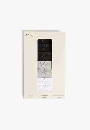 Packung mit sieben Baumwoll-Damenslips in Schwarz, Grau und Weiß, jeweils mit einer kleinen dekorativen Schleife, in beiger Verkaufsverpackung.