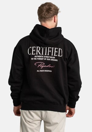 Black hoodie featuring a large white text "CERTIFIED" and smaller text below. Soft fabric with a relaxed fit and kangaroo pocket.