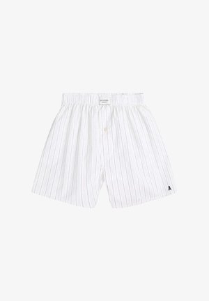 Pantalones cortos de algodón a rayas blancas con cintura elástica, cierre con botones y pequeño logo en la pierna izquierda. Diseño sencillo y transpirable.