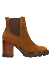 Stivaletto in suede marrone con tacco in legno massiccio marrone, pannelli elastici sui lati e cuciture a contrasto, dotato di punta rotonda e suola texturizzata.