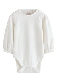 White long-sleeve baby bodysuit with small pink polka dots, snap buttons at shoulder and crotch, elastic cuffs on sleeves.