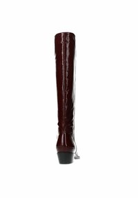 Knee-high burgundy patent leather boot with a sleek, shiny finish, tapered shape, and a rubber heel for stability.