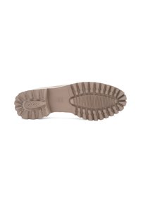 Beige shoe sole with deep, textured tread patterns. Features a rounded shape and raised logo in the center. Smooth rubber material.