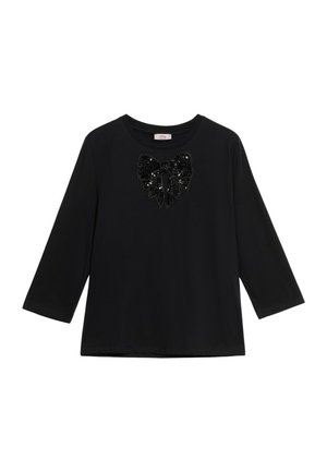 Maglietta nera a maniche lunghe con scollatura rotonda e grande fiocco di paillettes nere luccicanti al centro del petto.