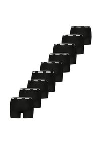 Black cotton boxer shorts with a wide elastic waistband, featuring repeating white "Puma" logo design, displayed in a staggered layout.