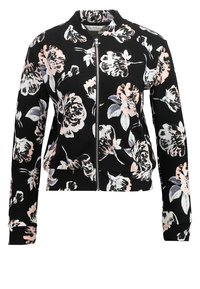 Sort lynlåsjakke med blomsterprint i pink og hvid. Lavet af et tekstureret stof med lange ærmer og en stående krave.