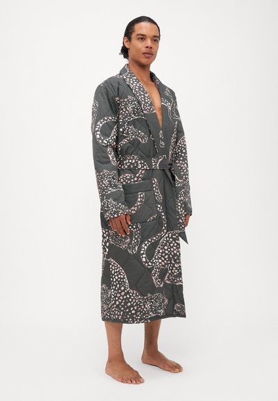 Quilted bathrobe in dark green with a pink animal print. Features a belt, pockets, and a mid-calf length with a shawl collar design.