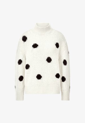 White knitted sweater with a high turtleneck, featuring large black polka dots and ribbed cuffs and hem. Soft texture and loose fit.