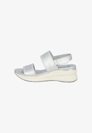 Silver leather sandals with two strap design, cushioned footbed, and a white wedge sole. Adjustable ankle strap for secure fit.
