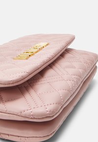 Quilted pink leather clutch with gold-tone hardware, featuring a textured surface and a flap closure. Stitched accents add detail.