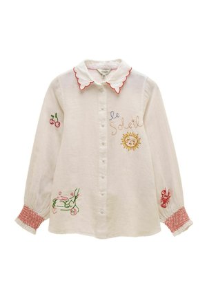 Weißes, langärmliges Hemd mit Knöpfen, geschwungenem Kragen, bestickt mit Sonne, Kirschen, Hummer, Roller und dem Schriftzug "le Soleil" auf Vorderseite und Ärmeln.