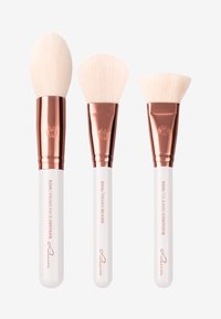 Set of three makeup brushes with soft, white bristles and rose gold ferrules, featuring white handles labeled for use: face, blush, and contour.