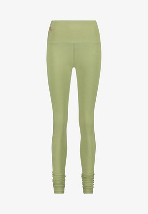 Light green full-length leggings made of stretchy fabric, featuring a high waistband and gathered detailing at the ankles.
