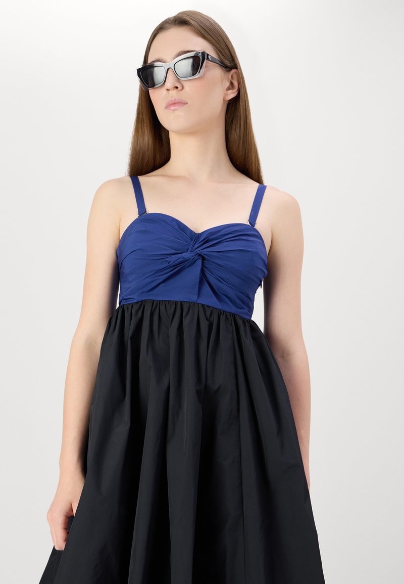 blue and black color block dress Original Penguin Women's Colorblock Tennis Dress in Bright White/White, Size Large