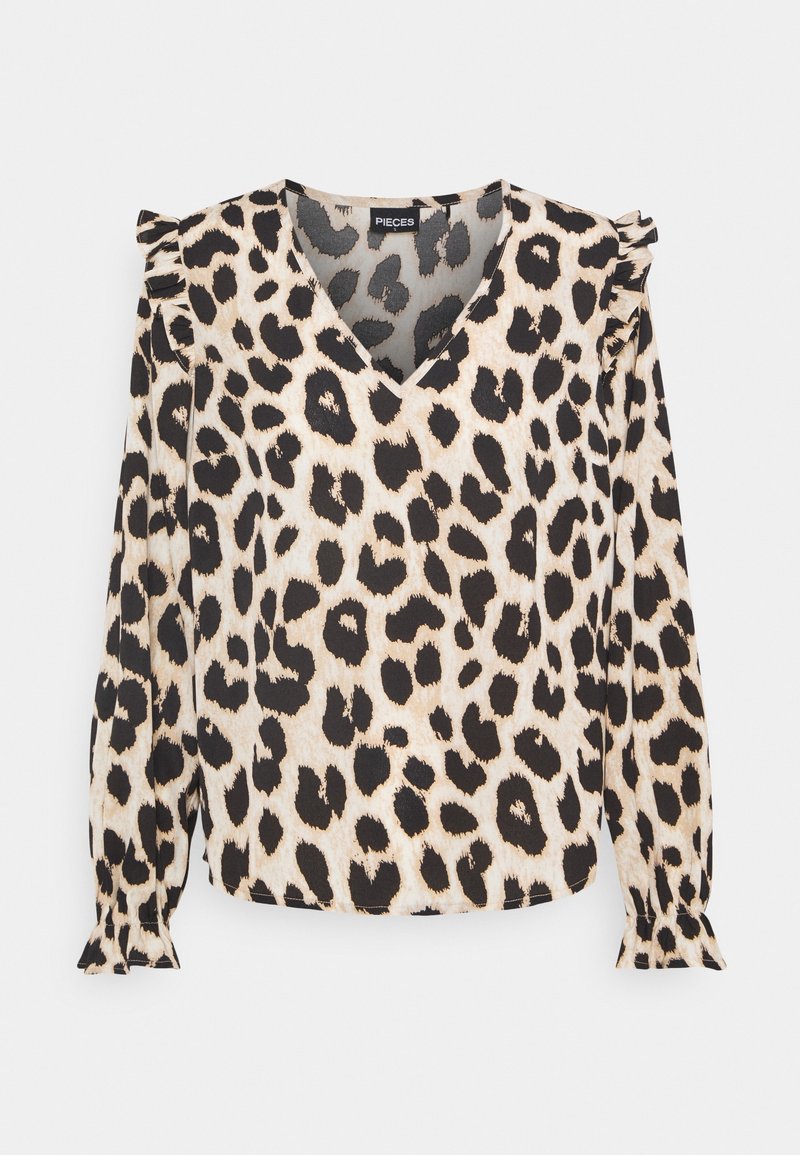 Blouse à imprimé léopard avec un col en V, des manches longues et des accents de volants aux épaules. Confectionnée en tissu doux beige avec des taches noires.