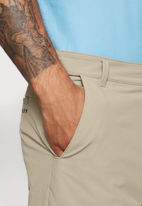 Oakley TAKE PRO PANT  - Calças - rye