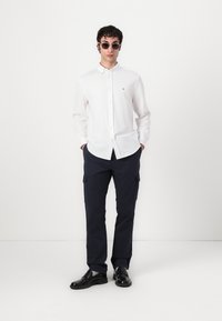 Tommy Hilfiger PERFORMANCE SOLID SHIRT - Shirt - optic white