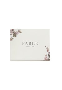 White box with "FABLE ENGLAND" text. Features floral design in pink and green on the top left corner. Smooth texture, rectangular shape.