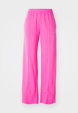 Pantalons de survêtement rose, ample et léger, avec une taille élastique et des coutures latérales. Présente un petit logo près de la cuisse supérieure gauche.