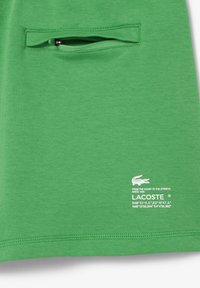 Lacoste Pantaloni sportivi - vert siw