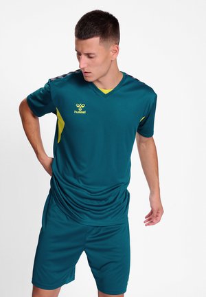 Teal sports jersey and shorts set, features a v-neck, short sleeves, yellow accents, and logo, made from lightweight, moisture-wicking fabric.