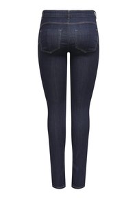 Donkerblauwe, aansluitende jeans met een gladde uitstraling, vijf zakken en subtiele stiksels aan de achterkant.