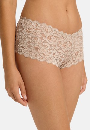 Lace boyshorts in a nude color, featuring a floral pattern with scalloped edges and a soft, sheer texture.