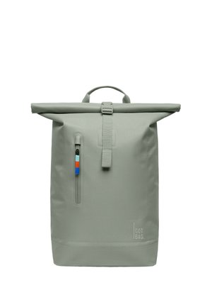 Roll-top backpack in light green, made of waterproof material. Features a side zipper pocket with colorful accents and a front strap closure.