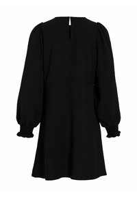 Robe noire à manches longues bouffantes, avec des poignets smockés et un dos en trou de serrure. Fabriquée dans un tissu texturé avec une silhouette évasée.
