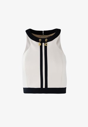 Top senza maniche bianco con colletto nero e righe verticali nere. Presenta dettagli in metallo dorato all'altezza del collo e una base nera uniforme.