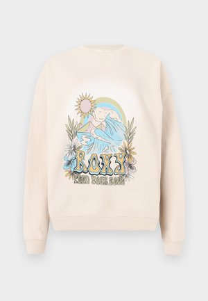 Beige sweatshirt featuring a colorful graphic design with mountains, waves, sun, and flowers. "ROXY" text displayed prominently.