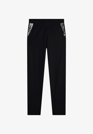 Pantalons de sport noirs avec une texture lisse, dotés de deux poches latérales avec un panneau transparent et à motifs, ainsi qu'une large taille élastique.