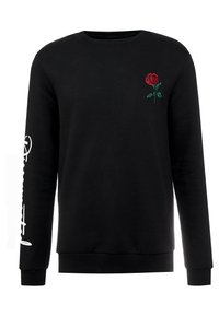 Felpa nera con maniche lunghe, collo rotondo, dettagli in ricamo di una rosa rossa sul petto e testo bianco lungo la manica sinistra. Materiale in cotone.