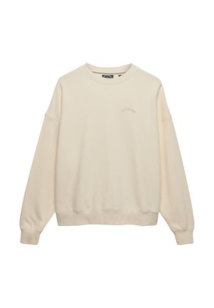 Sweat-shirt beige à col rond avec manches longues et logo discret « Superdry » sur la poitrine gauche, présenté sur fond blanc.