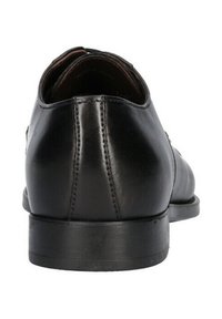 Scarpa da uomo in pelle nera con finitura liscia, punta arrotondata, dettagli cuciti e tacco basso e piatto. La vista posteriore non mostra accenti aggiuntivi.